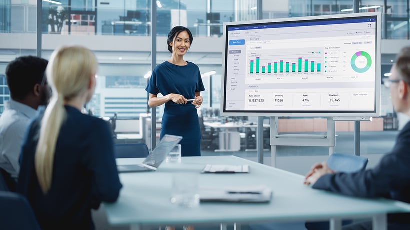Professional reviewing leadership analytics data on a screen